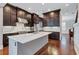 Gourmet kitchen with stainless appliances, large island, and custom cabinets at 326 Brownstones Ne Cir, Atlanta, GA 30312