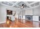 Open concept: living room with fireplace leads to the kitchen with center island and a staircase at 326 Brownstones Ne Cir, Atlanta, GA 30312