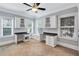 Bright office space with built-in cabinets, desk, and a cozy window seat at 326 Brownstones Ne Cir, Atlanta, GA 30312