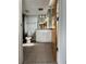Bright bathroom with granite countertops, tile floors, updated fixtures, and glass shower at 395 Central Park Ne Pl # 610, Atlanta, GA 30312
