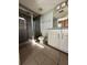 Bathroom featuring a glass shower, tile floors, and granite countertops at 395 Central Park Ne Pl # 610, Atlanta, GA 30312