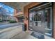 Building entrance featuring brick and concrete with metal doors and a security system at 395 Central Park Ne Pl # 610, Atlanta, GA 30312