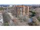Exterior photo showcasing a mid-rise brick condominium building with mature landscaping during winter at 395 Central Park Ne Pl # 610, Atlanta, GA 30312