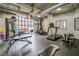 On-site gym features weights, bench, treadmills, exercise balls and large window for natural lighting at 395 Central Park Ne Pl # 610, Atlanta, GA 30312