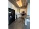 Stylish kitchen with stainless steel appliances, granite countertops, and white cabinetry at 395 Central Park Ne Pl # 610, Atlanta, GA 30312