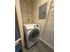 Modern laundry area with a new white Samsung washing machine at 395 Central Park Ne Pl # 610, Atlanta, GA 30312
