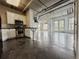 Modern kitchen seamlessly flows into a spacious living area with industrial-style ceilings at 395 Central Park Ne Pl # 610, Atlanta, GA 30312