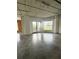 Spacious living area featuring exposed brick and a balcony with great natural light at 395 Central Park Ne Pl # 610, Atlanta, GA 30312