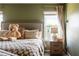 Bright main bedroom with neutral tones with lots of natural light and a view of the pond at 13568 Scenic Pkwy, Covington, GA 30014