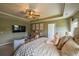 Spacious main bedroom with sitting area, view of pond at 13568 Scenic Pkwy, Covington, GA 30014