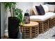 Stylish outdoor seating area with comfortable cushions, a woven table, and potted greenery for a relaxing ambiance at 13568 Scenic Pkwy, Covington, GA 30014