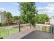 Back deck overlooking a large, well-maintained backyard surrounded by lush trees at 3190 Red Rose Dr, Powder Springs, GA 30127