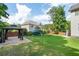 Large backyard with a playset, gazebo and a well manicured lawn at 3190 Red Rose Dr, Powder Springs, GA 30127