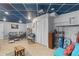 Cozy basement with tiled flooring, seating, and extra storage space at 3190 Red Rose Dr, Powder Springs, GA 30127
