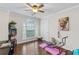 Bright bedroom with hardwood floors and a comfortable workspace area at 3190 Red Rose Dr, Powder Springs, GA 30127