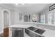 Kitchen featuring stainless steel sink, white cabinetry, and a modern design at 3190 Red Rose Dr, Powder Springs, GA 30127