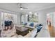 Living room with large sectional, view to dining room and cozy decor at 3190 Red Rose Dr, Powder Springs, GA 30127