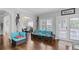 Cozy living room features modern decor, hardwood floors, and a calming color palette at 3190 Red Rose Dr, Powder Springs, GA 30127