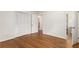 Bedroom with hardwood floors and natural light from a window at 4149 Indian Lake Cir, Stone Mountain, GA 30083