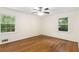 Bright bedroom featuring hardwood floors and large windows for natural light at 4149 Indian Lake Cir, Stone Mountain, GA 30083