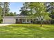 Charming brick home with well-maintained front yard and landscaping at 4149 Indian Lake Cir, Stone Mountain, GA 30083