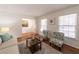 Bright living room with neutral paint, natural light, hardwood floors, and modern furniture at 4149 Indian Lake Cir, Stone Mountain, GA 30083
