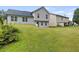 Expansive backyard with lush lawn and partial view of home's exterior at 5900 Union Woods Way, Union City, GA 30291