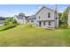 View of the home's backyard, showing the lush green lawn and patio area at 5900 Union Woods Way, Union City, GA 30291