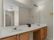 Bright bathroom features double sinks and large mirror at 5900 Union Woods Way, Union City, GA 30291