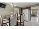 Bright breakfast nook with counter seating, tiled flooring, and stainless steel refrigerator at 5900 Union Woods Way, Union City, GA 30291