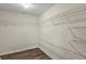 Large walk-in closet featuring wood floors and metal shelving at 5900 Union Woods Way, Union City, GA 30291