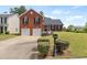 Charming two-story brick home with a well-manicured front yard and a two-car garage at 5900 Union Woods Way, Union City, GA 30291
