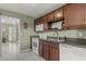 Well-lit kitchen equipped with white appliances and beautiful tile flooring at 5900 Union Woods Way, Union City, GA 30291