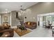 Open-concept living room features neutral walls, tiled floor, stairs, and ample natural light at 5900 Union Woods Way, Union City, GA 30291