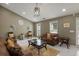 Inviting living room featuring vaulted ceilings, tiled floor, modern lighting, and a stylish layout at 5900 Union Woods Way, Union City, GA 30291