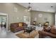 Comfortable living room with high ceilings, modern lighting, and tiled floors at 5900 Union Woods Way, Union City, GA 30291