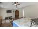 Bright main bedroom with wood floors, high ceilings, and an elegant king bed at 5900 Union Woods Way, Union City, GA 30291