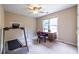 Bedroom featuring treadmill, desk, and natural light at 616 Piping Rock Pt, Lawrenceville, GA 30043
