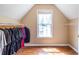 Walk-in closet features built-in shelving and a large window for natural light at 616 Piping Rock Pt, Lawrenceville, GA 30043