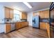 Spacious kitchen with wood cabinets, stainless steel appliances and hardwood floors at 616 Piping Rock Pt, Lawrenceville, GA 30043