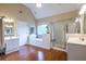 Bright main bathroom with dual sinks, walk-in shower, and soaking tub with tile surround at 616 Piping Rock Pt, Lawrenceville, GA 30043