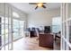 Bright office space featuring French doors, hardwood floors, and large windows at 616 Piping Rock Pt, Lawrenceville, GA 30043