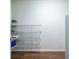 Walk-in pantry featuring hardwood floors, plenty of shelves, and ample storage space for organized kitchen essentials at 616 Piping Rock Pt, Lawrenceville, GA 30043