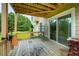 Wooden deck overlooking a lush green backyard with sliding glass doors, blending indoor-outdoor living at 773 Van Briggle Path, Sugar Hill, GA 30518