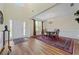 Formal dining room featuring hardwood floors, a chandelier, and ample natural light at 773 Van Briggle Path, Sugar Hill, GA 30518