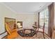 Cozy living room with hardwood floors, a neutral color palette, and lots of natural light at 773 Van Briggle Path, Sugar Hill, GA 30518