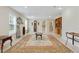 Spacious living room featuring tile flooring, neutral walls, and vintage decor at 773 Van Briggle Path, Sugar Hill, GA 30518