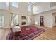 Bright and airy living room with tall ceilings, a fireplace, and hardwood floors at 773 Van Briggle Path, Sugar Hill, GA 30518