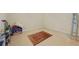 Small storage room featuring neutral walls and floors, with shelving and household items at 773 Van Briggle Path, Sugar Hill, GA 30518