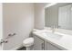 Bathroom with gray vanity, white countertop and backsplash, and modern fixtures at 10150 Puckett St, Covington, GA 30014